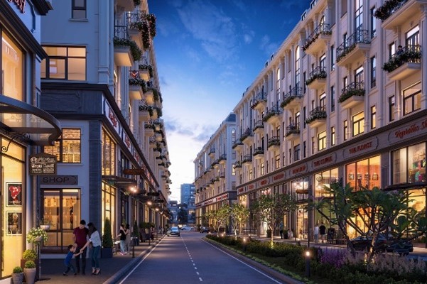 An image of apartments and condos above businesses on a city street.