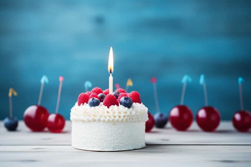 Image of a cake with a single lit candle to celebrate National Mortgage Professional Month.