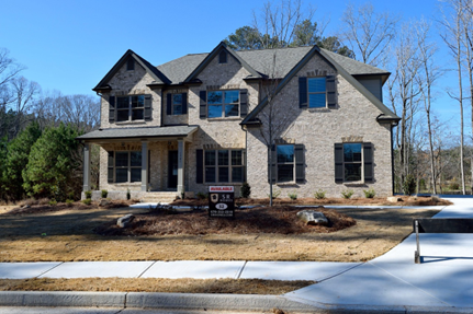 Image of a brick suburban home for sale.